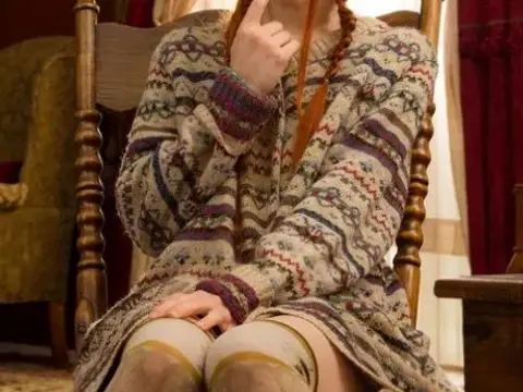 Young looking redhead Dolly Little gets naked in over the knee socks