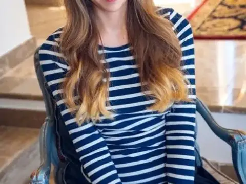 Charming teen Kay J flashes her polkadot underwear before getting bare naked